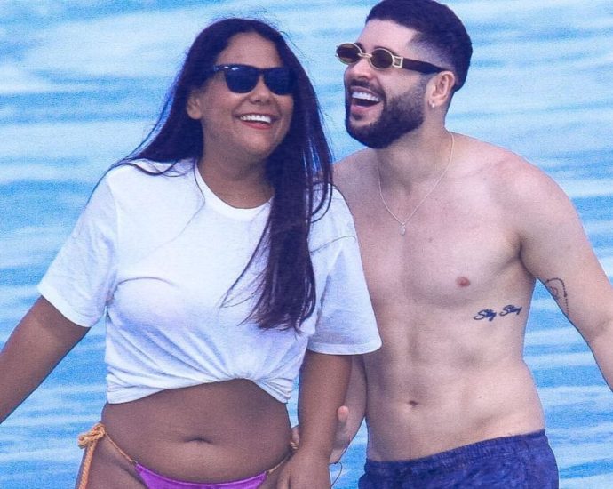 Ex-BBBs Chaiany e Marcelinho são flagrados por paparazzo na praia