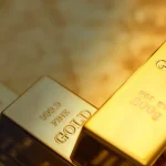 Ouro encerra dia em baixa devido a postura restritiva do Fed e aumento dos juros dos Treasuries